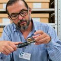 Nicolas Delsol, a researcher with the Florida Museum of Natural History, examines the tooth of the first domesticated horse found in the Americas.