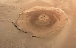 An image of Olympus Mons, the solar system's largest volcano, captured by the European Space Agency's (ESA) Mars Express Mission. The latest study found evidence that an underground lava plume may be pushing up on the entire area around the volcano. Photo by ESA/DLR/FUBerlin/AndreaLuck - Olympus Mons - ESA Mars Express, CC BY 2.0, https://commons.wikimedia.org/w/index.php?curid=130092547